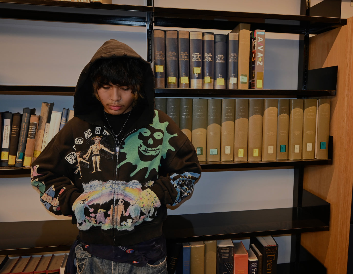 person wearing a hoodie masterpiece made from phobia